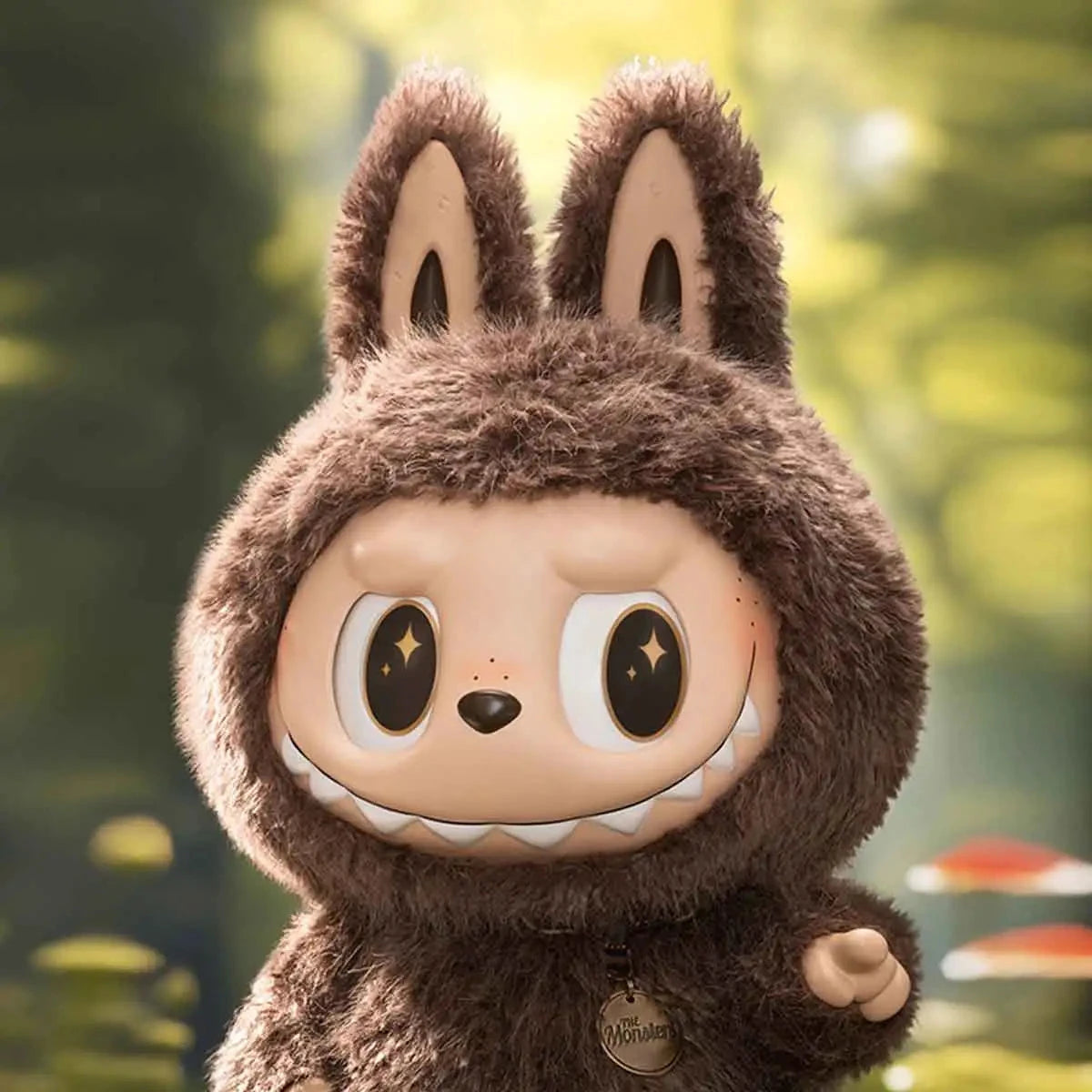 Cute fuzzy brown monster figurine with big eyes, pointed ears, forest background, collectible toy