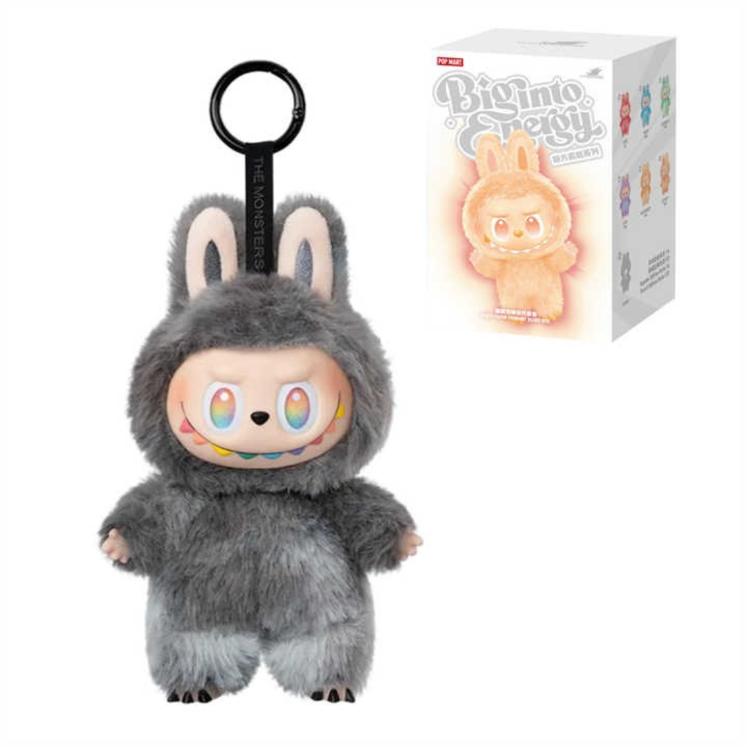 Grey furry bunny keychain plush toy with rainbow eyes, box packaging in background