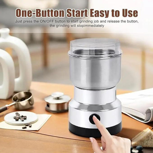 Stainless steel electric coffee grinder with one-button start on a kitchen table